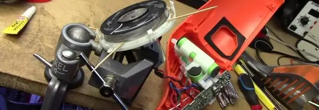 Vacuum cleaner repair parts and tools on a workbench in Akron, OH